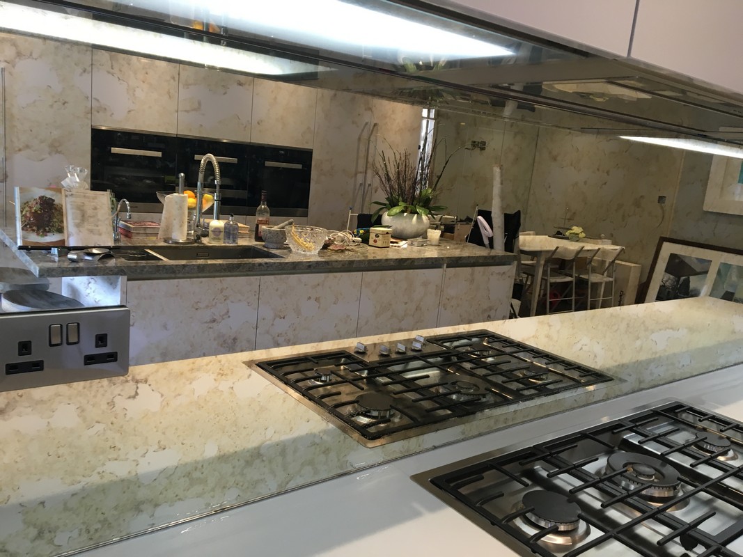 Mirror glass splashback in West Kensington luxury kitchen
